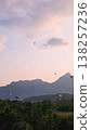 Looking at the rising hot air balloon  138257236