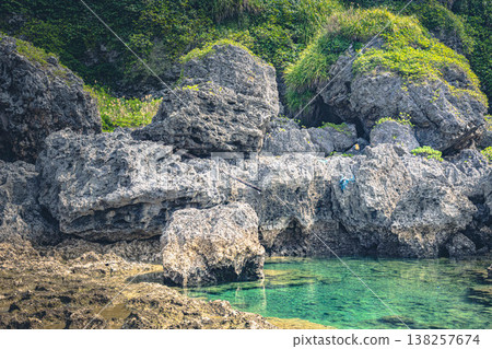 The beautiful sea visible between the rocks The beautiful sea visible between the rocks 138257674