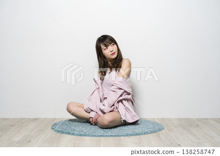 Woman relaxing in room wear Woman relaxing in room wear 138258747