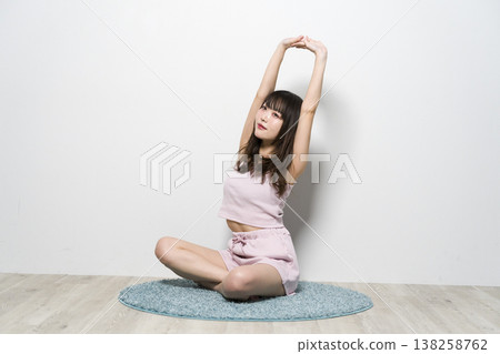 Woman relaxing in room wear Woman relaxing in room wear 138258762