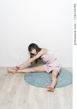 Woman relaxing in room wear Woman relaxing in room wear 138258768