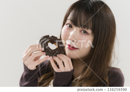 A woman eating a donut A woman eating a donut 138259390