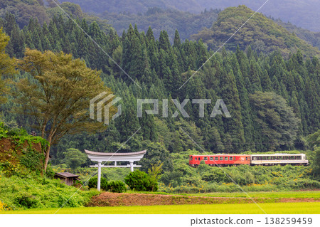 The torii gate of Hachiman Shrine and the Moriyoshi express train on the Akita Inland Line. The torii gate of Hachiman Shrine and the Moriyoshi express train on the Akita Inland Line. 138259459