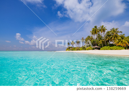 Idyllic tropical beach, sun loungers, umbrellas, swaying palms, calm turquoise sea, summer travel 138259669
