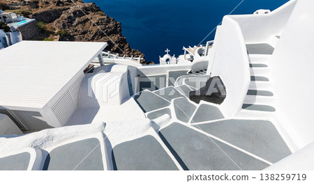 Stunning Santorini Oia white stairs luxury hotel terrace, radiant romantic summer vacation tourism background Greece 138259719