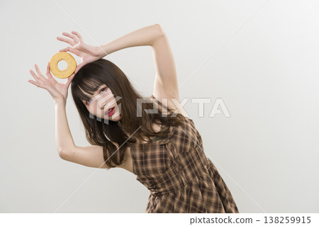 A woman holding a Baumkuchen A woman holding a Baumkuchen 138259915