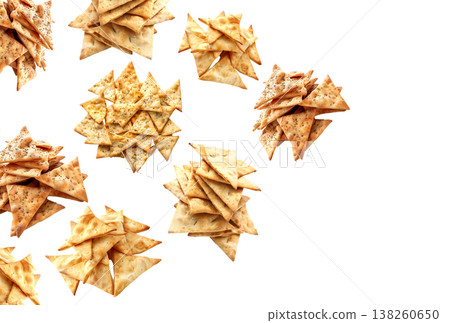Assorted piles of potato chips isolated on white background illustrating snack food concept idea 138260650