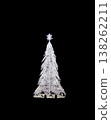 Glowing beautiful white Christmas tree on a black background. New Year tree. 138262211