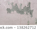 Peeling pink wall with cracked plaster and rough texture, weathered surface revealing gray cement underneath, abstract grunge background. 138262712