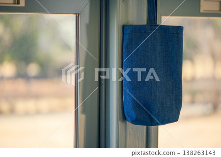 A tote bag hanging inside the car A tote bag hanging inside the car 138263143