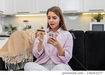 Young woman card declined on mobile payment low balance alert bank panic about fraud with smartphone 138263277
