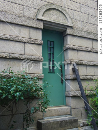 A retro building with a green door 138263406