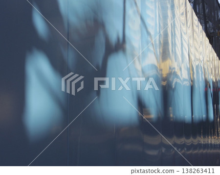 Silhouettes projected onto the temporary fence Silhouettes projected onto the temporary fence 138263411