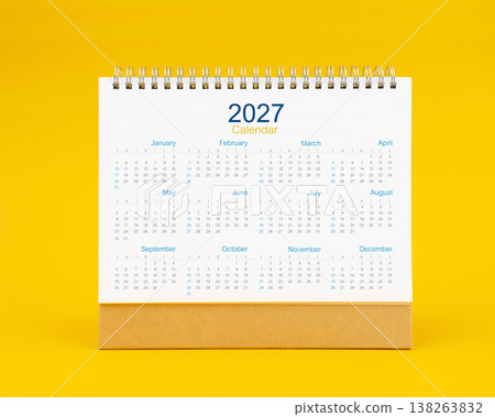 Yearly 2027 desk calendar on yellow color background, Front view. Yearly 2027 desk calendar on yellow color background, Front view. 138263832