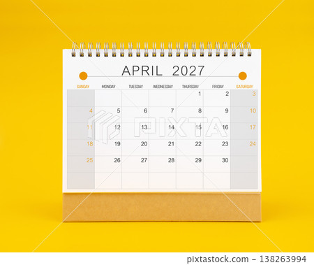 April 2027 desk calendar on yellow color background, Front view. April 2027 desk calendar on yellow color background, Front view. 138263994