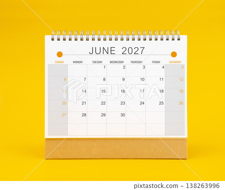 June 2027 desk calendar on yellow color background, Front view. 138263996