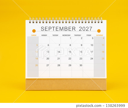September 2027 desk calendar on yellow color background, Front view. September 2027 desk calendar on yellow color background, Front view. 138263999