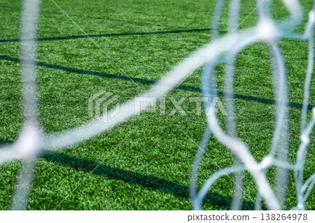 Soccer field green grass and net background. Soccer field green grass and net background. 138264978
