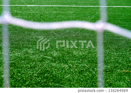 Soccer field green grass and net background. Soccer field green grass and net background. 138264984