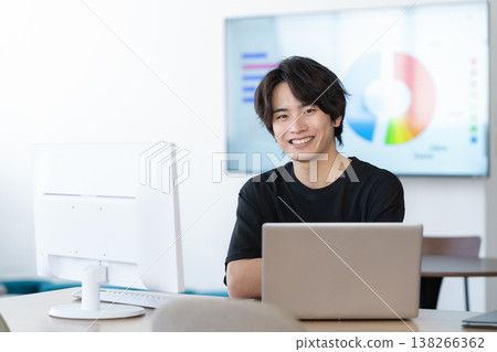 A young male engineer working on a computer in the office. A young male engineer working on a computer in the office. 138266362