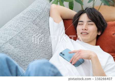 A young man taking a nap on the sofa 138266407