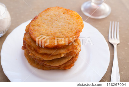 Crispy Potato Fritters Layered on Porcelain Dish Crispy Potato Fritters Layered on Porcelain Dish 138267004