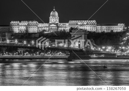Night view of Szechenyi Chain Bridge on the Danube river, with Buda Castle in the background, in Budapest Hungary Night view of Szechenyi Chain Bridge on the Danube river, with Buda Castle in the background, in Budapest Hungary 138267050