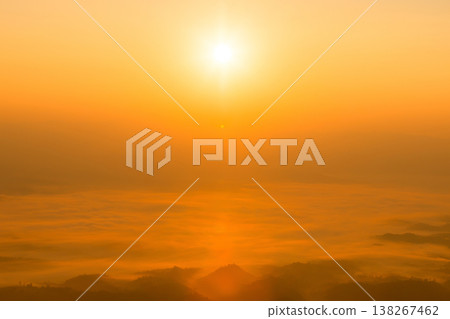 Golden sunrise over sea of clouds and misty mountain ridges, warm orange sky with glowing sun. Calm nature panorama with copy space for travel, wellness, meditation, branding, design. calm, peaceful Golden sunrise over sea of clouds and misty mountain ridges, warm orange sky with glowing sun. Calm nature panorama with copy space for travel, wellness, meditation, branding, design. calm, peaceful 138267462