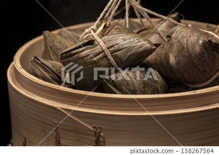 Traditional bamboo steamers for steaming delicious zongzi (sticky rice dumplings) for Dragon Boat Festival Traditional bamboo steamers for steaming delicious zongzi (sticky rice dumplings) for Dragon Boat Festival 138267564