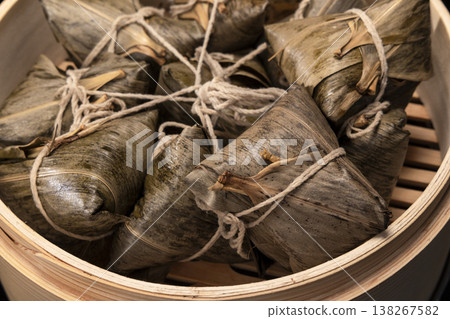 Traditional bamboo steamers for steaming delicious zongzi (sticky rice dumplings) for Dragon Boat Festival Traditional bamboo steamers for steaming delicious zongzi (sticky rice dumplings) for Dragon Boat Festival 138267582