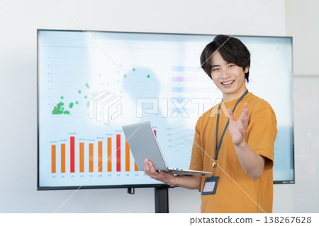 A young male engineer working on his office computer. A young male engineer working on his office computer. 138267628