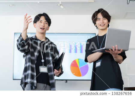 A young male engineer working on his office computer. 138267656
