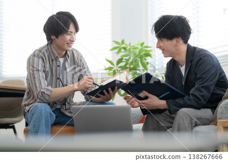 A young male engineer working on his office computer. A young male engineer working on his office computer. 138267666