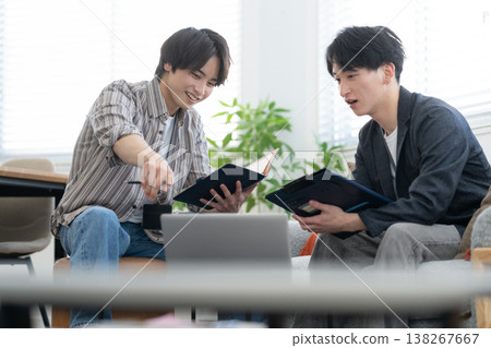 A young male engineer working on his office computer. 138267667