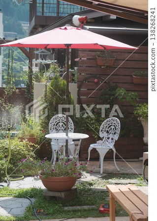 Rustic Garden Patio With Wrought Iron Furniture 138268241