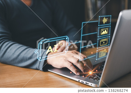 A person types on a laptop with glowing AI interface graphics displaying icons for text,image,video,and audio generation, symbolizing artificial intelligence creativity and digital content innovation. A person types on a laptop with glowing AI interface graphics displaying icons for text,image,video,and audio generation, symbolizing artificial intelligence creativity and digital content innovation. 138268274