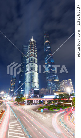 Shanghai's skyscrapers and trails of light create a glittering urban nightscape. 138269237
