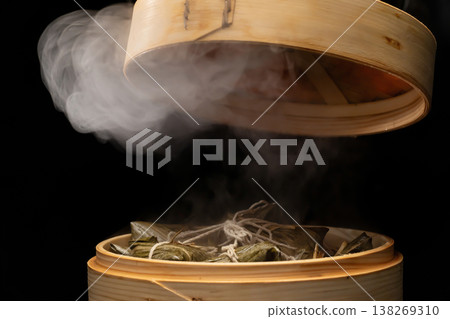 Traditional bamboo steamers for steaming delicious zongzi (sticky rice dumplings) for Dragon Boat Festival Traditional bamboo steamers for steaming delicious zongzi (sticky rice dumplings) for Dragon Boat Festival 138269310