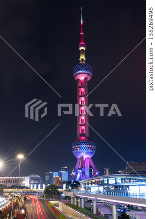 The Oriental Pearl Tower of Shanghai, illuminated in purple, and the trails of light create a stunning nighttime view. The Oriental Pearl Tower of Shanghai, illuminated in purple, and the trails of light create a stunning nighttime view. 138269496