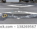 Text encouraging temporary paving and diamond-shaped road markings after waterworks construction. 138269567