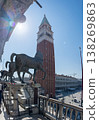 Bronze horses and bell tower in sunny Italian square 138269863