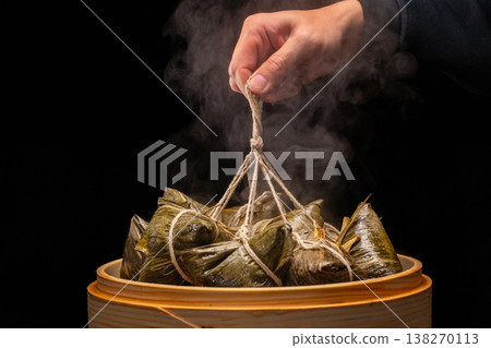 Traditional bamboo steamers for steaming delicious zongzi (sticky rice dumplings) for Dragon Boat Festival Traditional bamboo steamers for steaming delicious zongzi (sticky rice dumplings) for Dragon Boat Festival 138270113
