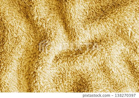Crumpled fluffy yellow terry towel microfiber fabric texture with wrinkles and waves background 138270397