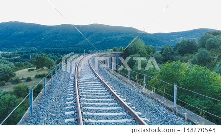 Railway tracks curving over a viaduct bridge Railway tracks curving over a viaduct bridge 138270543