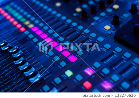 Concert sound mixer panel with volume regulators. Professional audio and light equipment for sound recording studio, live music broadcasting, television, party. mixing console. audio signals Concert sound mixer panel with volume regulators. Professional audio and light equipment for sound recording studio, live music broadcasting, television, party. mixing console. audio signals 138270620