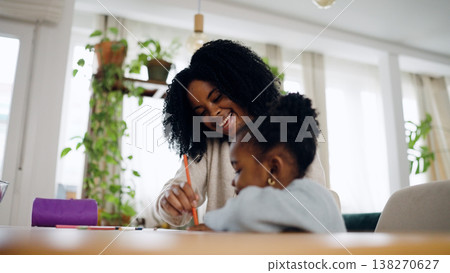 African American mother and daughter drawing together at home 138270627