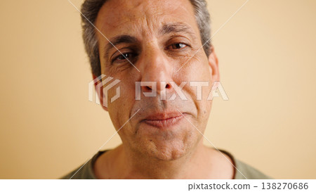 Middle aged man close up portrait with neutral expression 138270686