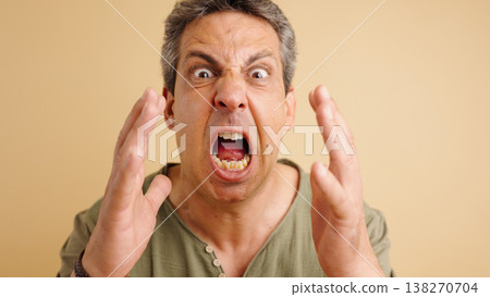 Mature man screaming in rage and frustration 138270704