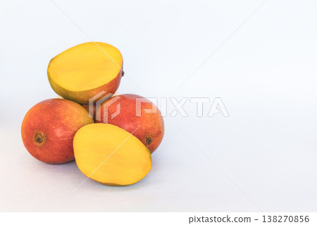 Organic whole mangoes on white background. Organic whole mangoes on white background. 138270856