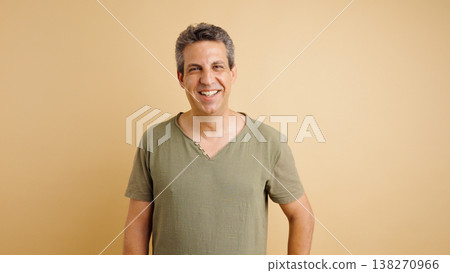 Smiling middle aged man feeling cheerful and confident Smiling middle aged man feeling cheerful and confident 138270966